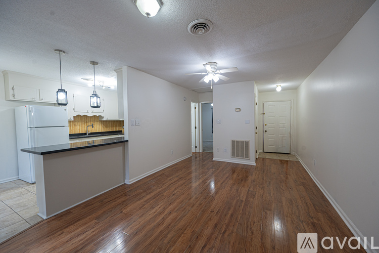 A kitchen with wooden cabinets and white appliances.