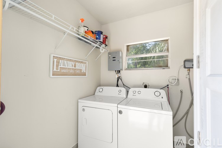 A laundry room with a washer and dryer.