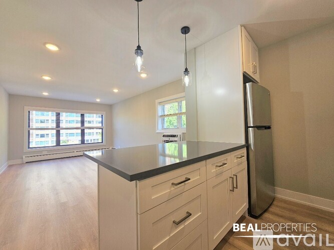 A kitchen with a stove top oven and microwave above it.