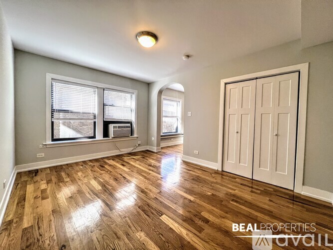 A kitchen with wooden cabinets and a washing machine.