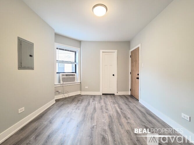 A kitchen with dark wood cabinets and stainless steel appliances is on the market.