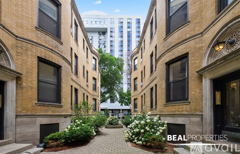 A BEALPROPERTIES sign is on the front of a building.
