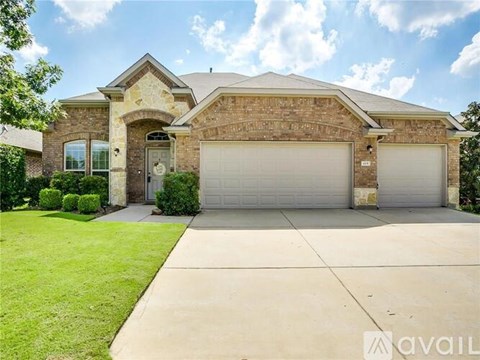 A house with a garage and a driveway is for sale.