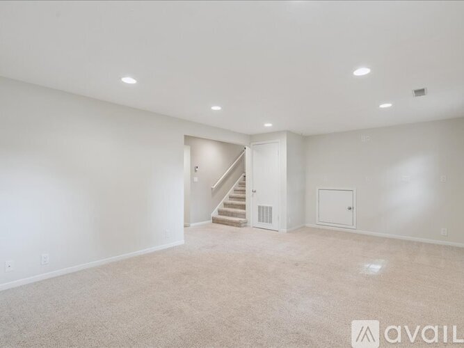 A floor plan of a house with a master bedroom, two additional bedrooms, and a bathroom.