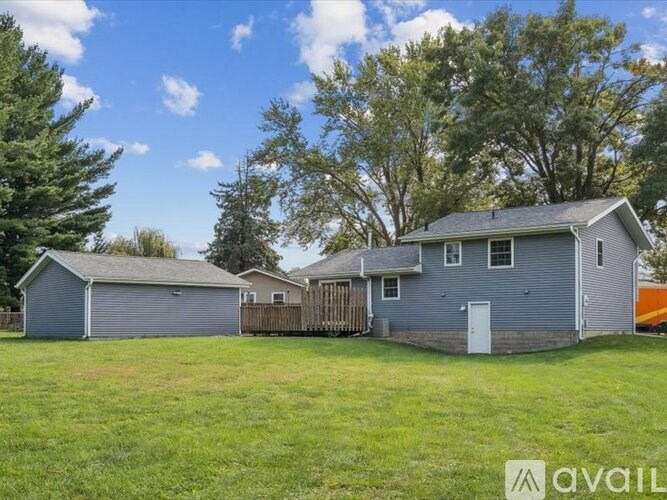 A house with a garage is available for sale.