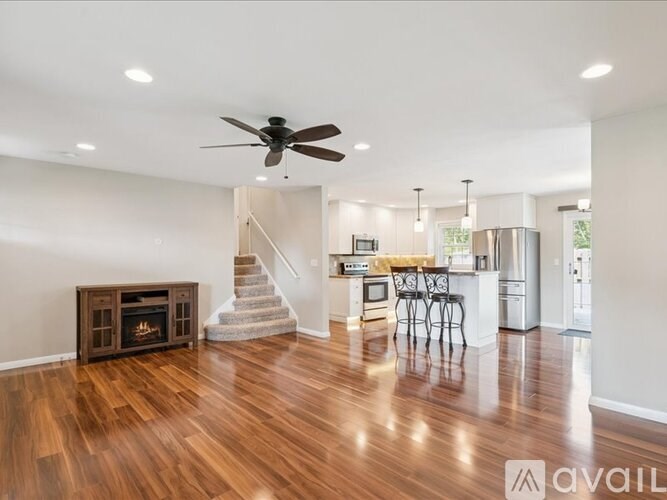 A house with a grey roof and a wooden deck.