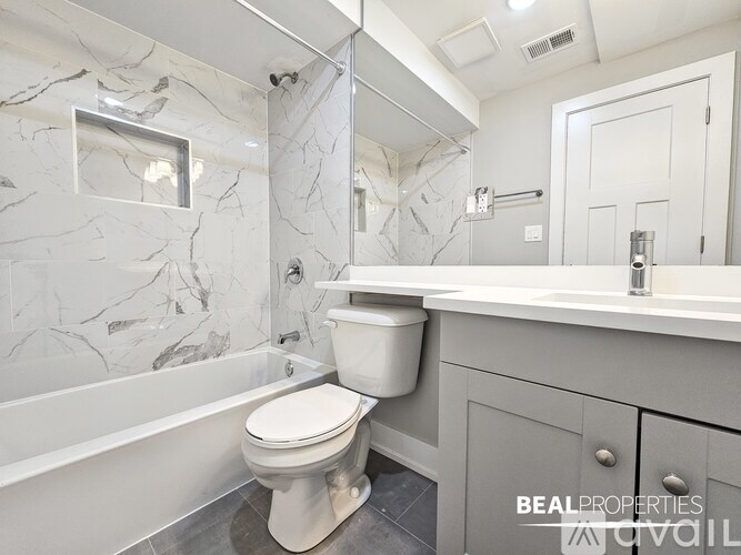 A white dishwasher is installed in a kitchen.