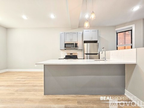 A white dishwasher is installed in a kitchen.