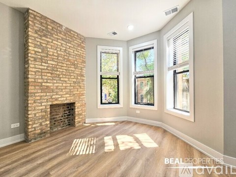 A white oven is in a kitchen with a wooden floor.
