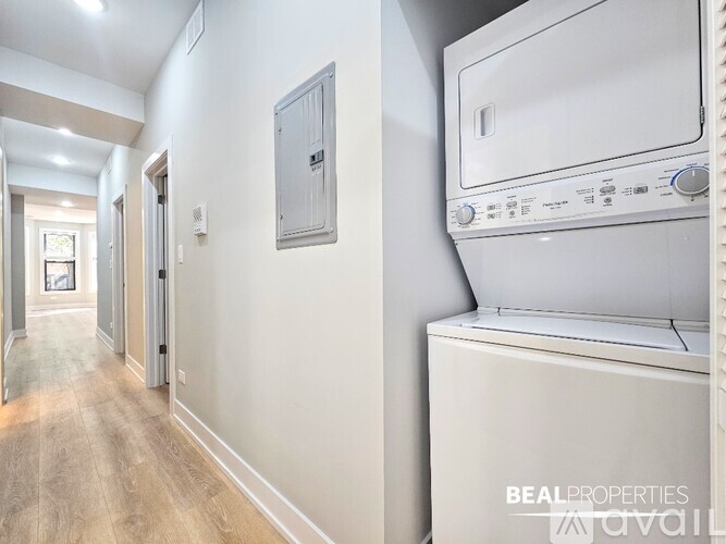 A kitchen with a stove, microwave, and refrigerator.