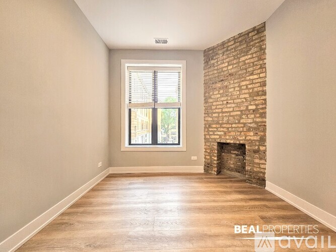 A spacious room with a door leading to another room.