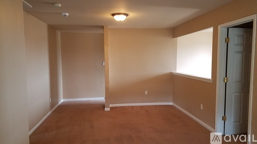 A room with a door and a window.