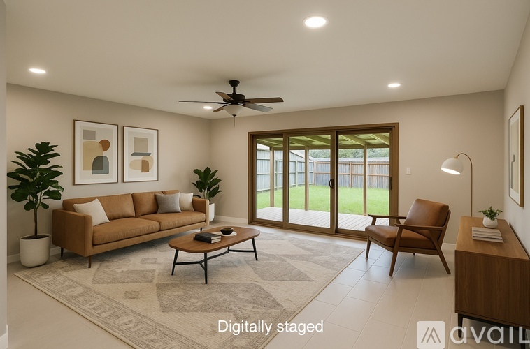 A living room with a brown sofa, a coffee table, and a ceiling fan.