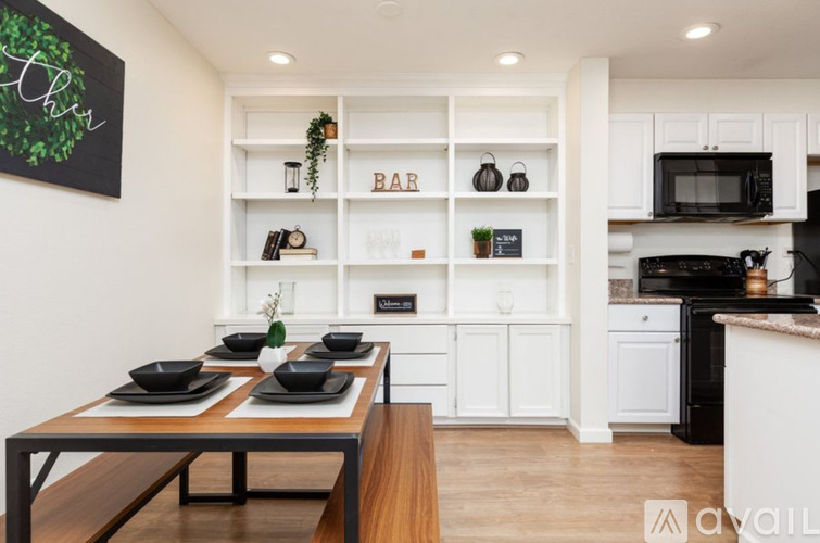 A kitchen with a bar area in the middle.