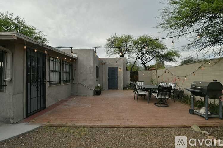 A patio area with a table and chairs is available.
