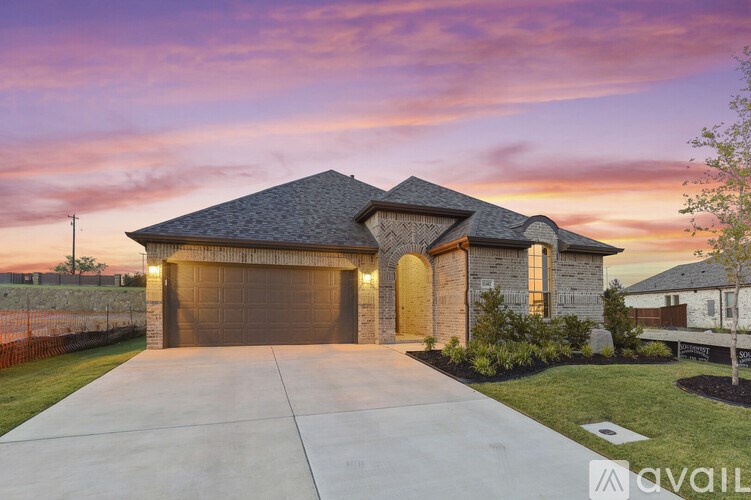 A house with a driveway in front of it.