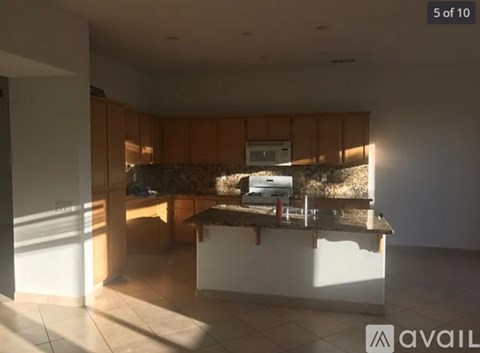 A kitchen with a counter and cabinets.