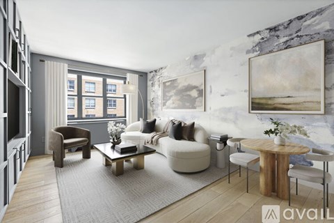 A modern living room with a grey rug, a white sofa, a wooden coffee table, and a large painting on the wall.