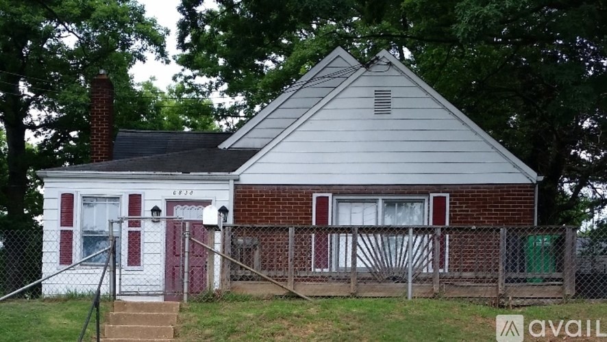 A small house with a red door and a sign that says "available".
