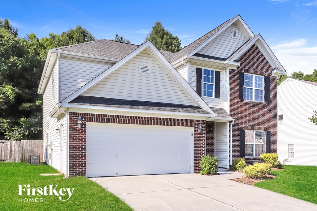 A two-story house with a garage is for sale by FirstKey Homes.