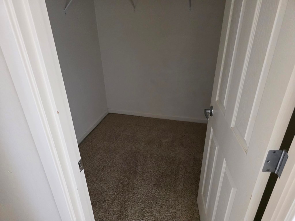 A white door with a silver handle is closed.