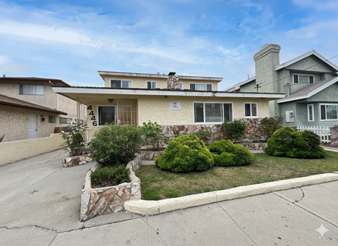 A house with a well-maintained front yard.