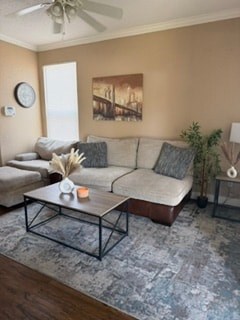 A living room with a couch, a coffee table, and a painting on the wall.