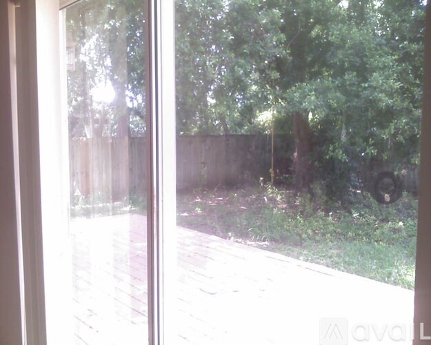A view of a backyard through a window.