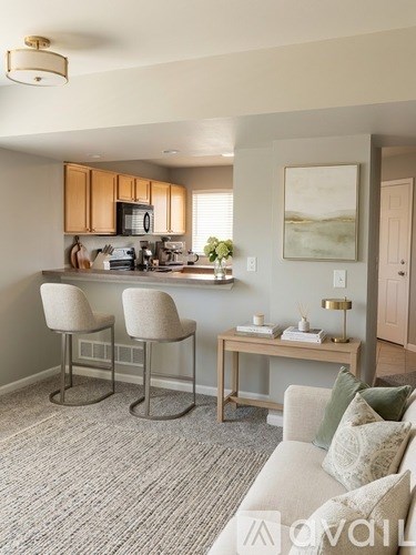 A small laundry room with a washer and dryer.