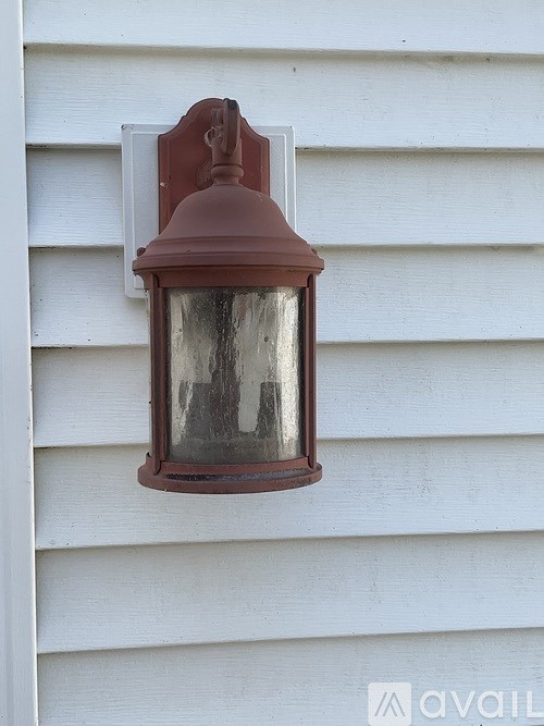 A white toilet sits next to a white sink in a bathroom.