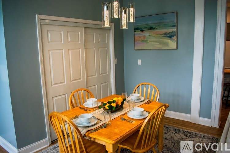 A white toilet in a bathroom with a Surfdog poster on the wall.