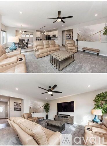 A living room with a large sectional sofa and a flat screen TV.
