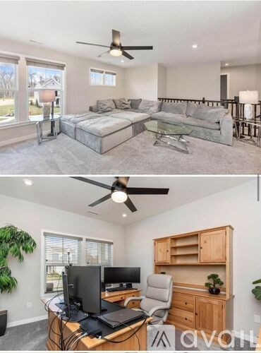A bedroom with a bed and a desk with a computer.
