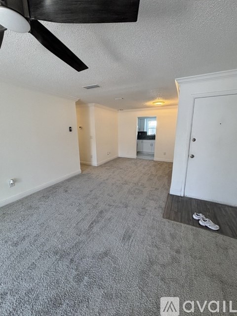 A room with a grey floor and white walls.