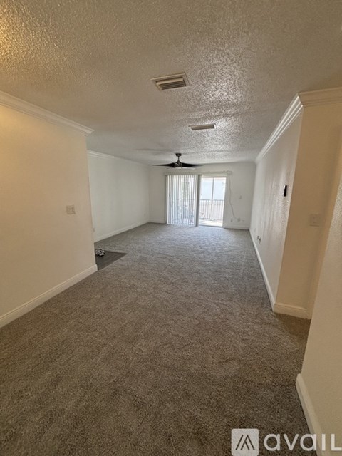 A bathroom with a sink, toilet and mirror.