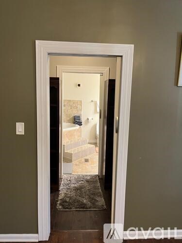 A white door with a glass window in the middle.