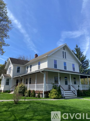 A white house with a blue sky in the background.
