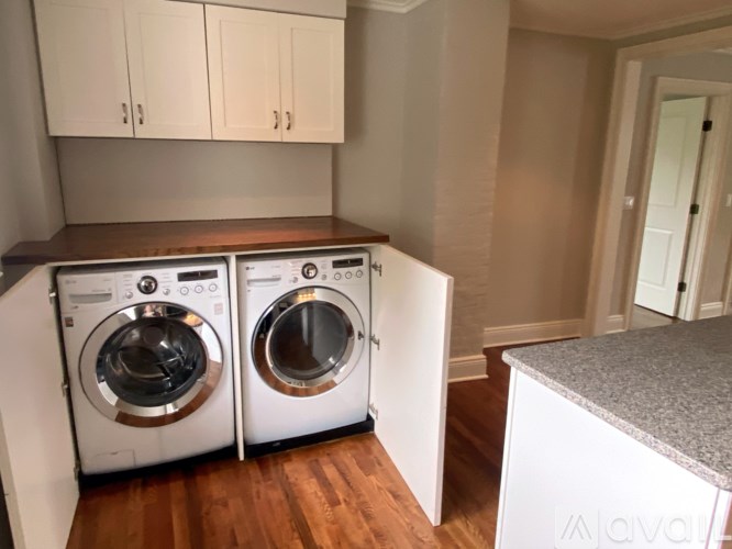 A laundry room with a washer and dryer.