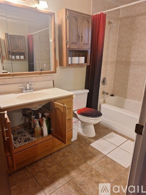 A bathroom with a toilet and a sink.