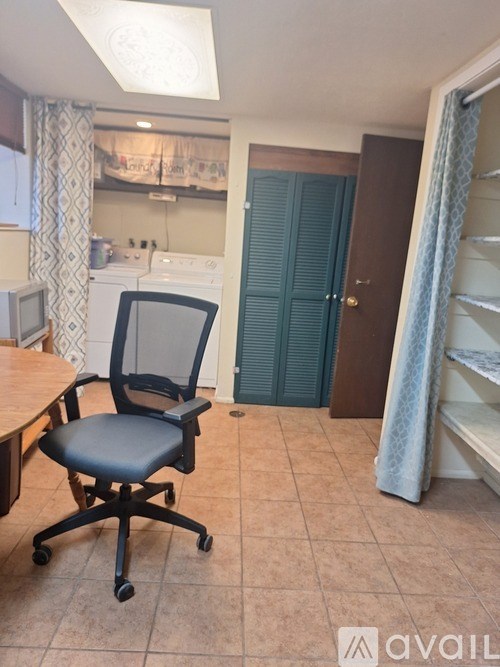 A small room with a chair and a table.