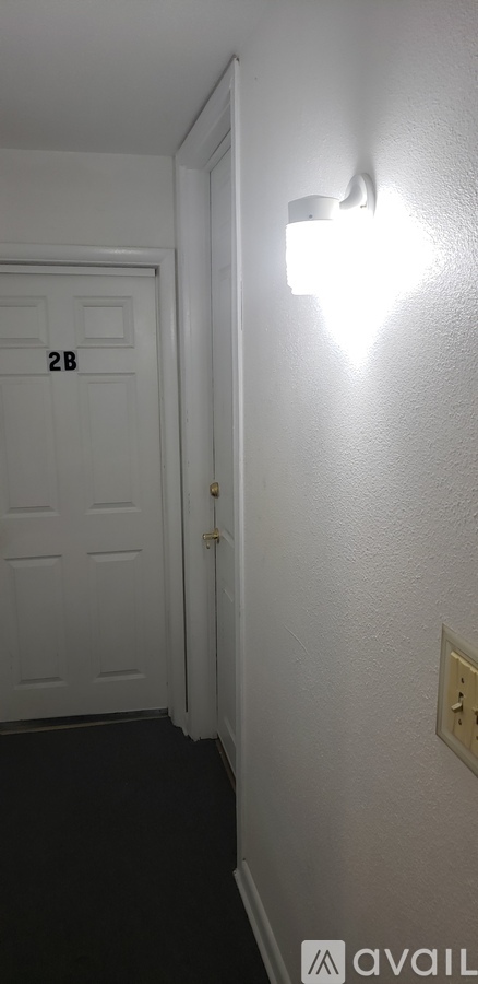 A white door with a number 28 on it.