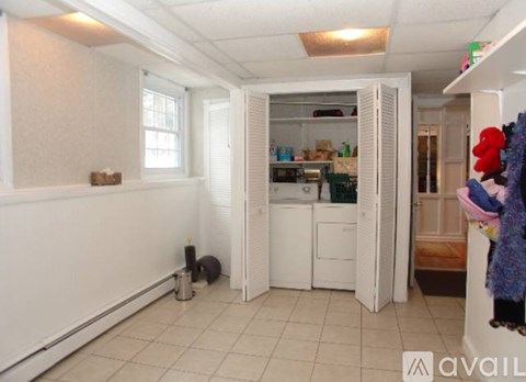 A kitchen with white appliances and a white fridge.