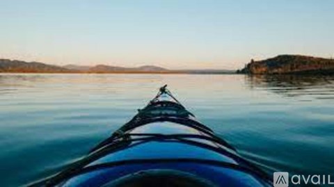 A view from the front of a boat on a calm body of water.