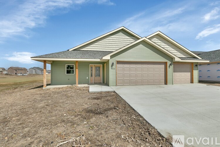 A house with a garage is available for sale.