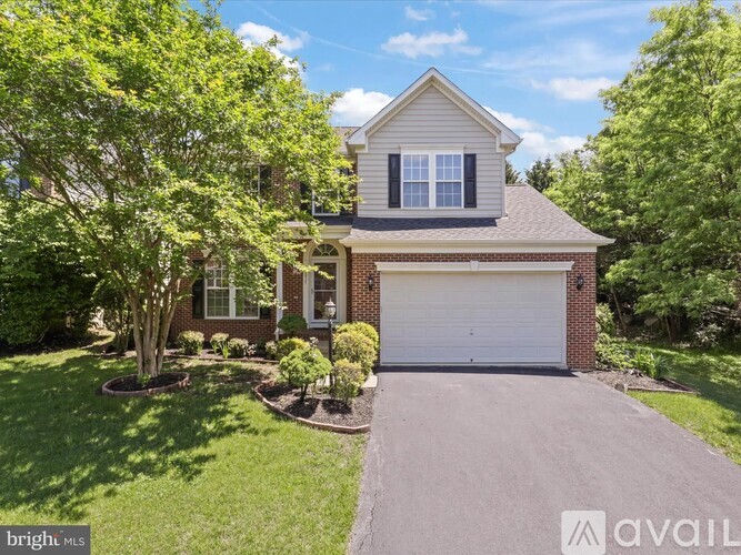 A house with a garage is for sale.