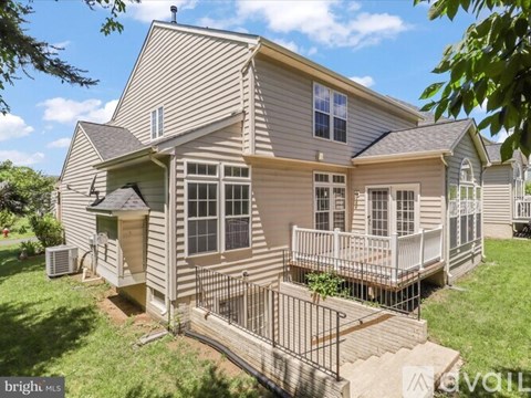 A house with a deck and a patio.