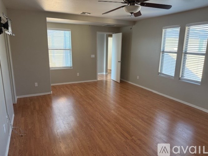 A kitchen with green walls and a granite countertop.