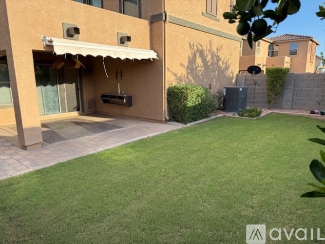 A house with a patio and a white awning.