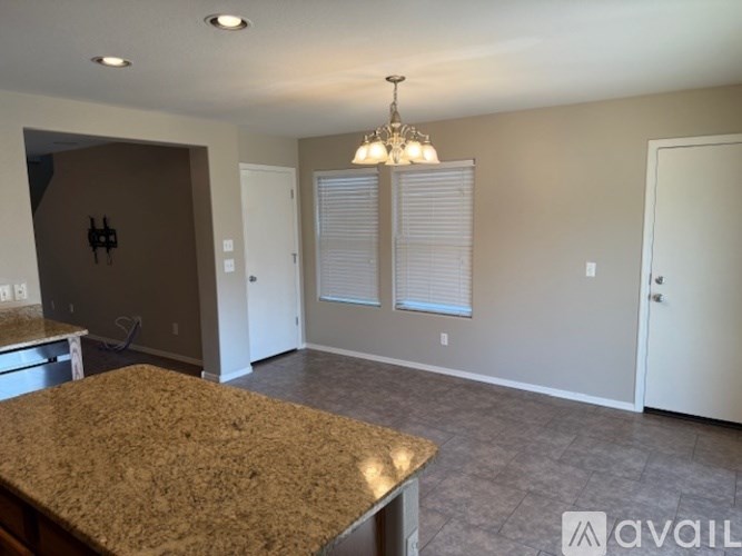 A small laundry room with a washer and dryer.