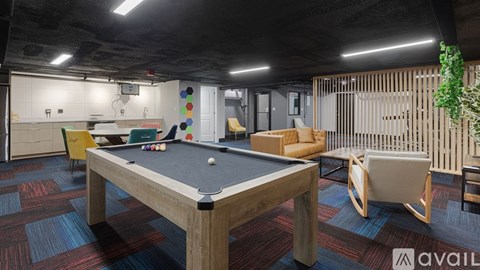 A pool table is in the middle of a room with a wooden floor and a wooden wall.